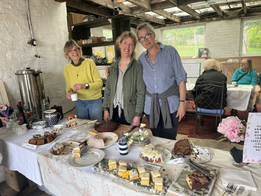 Volunteers at a fundraiser cake sale